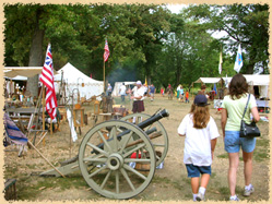 attendees walking past a cannon
